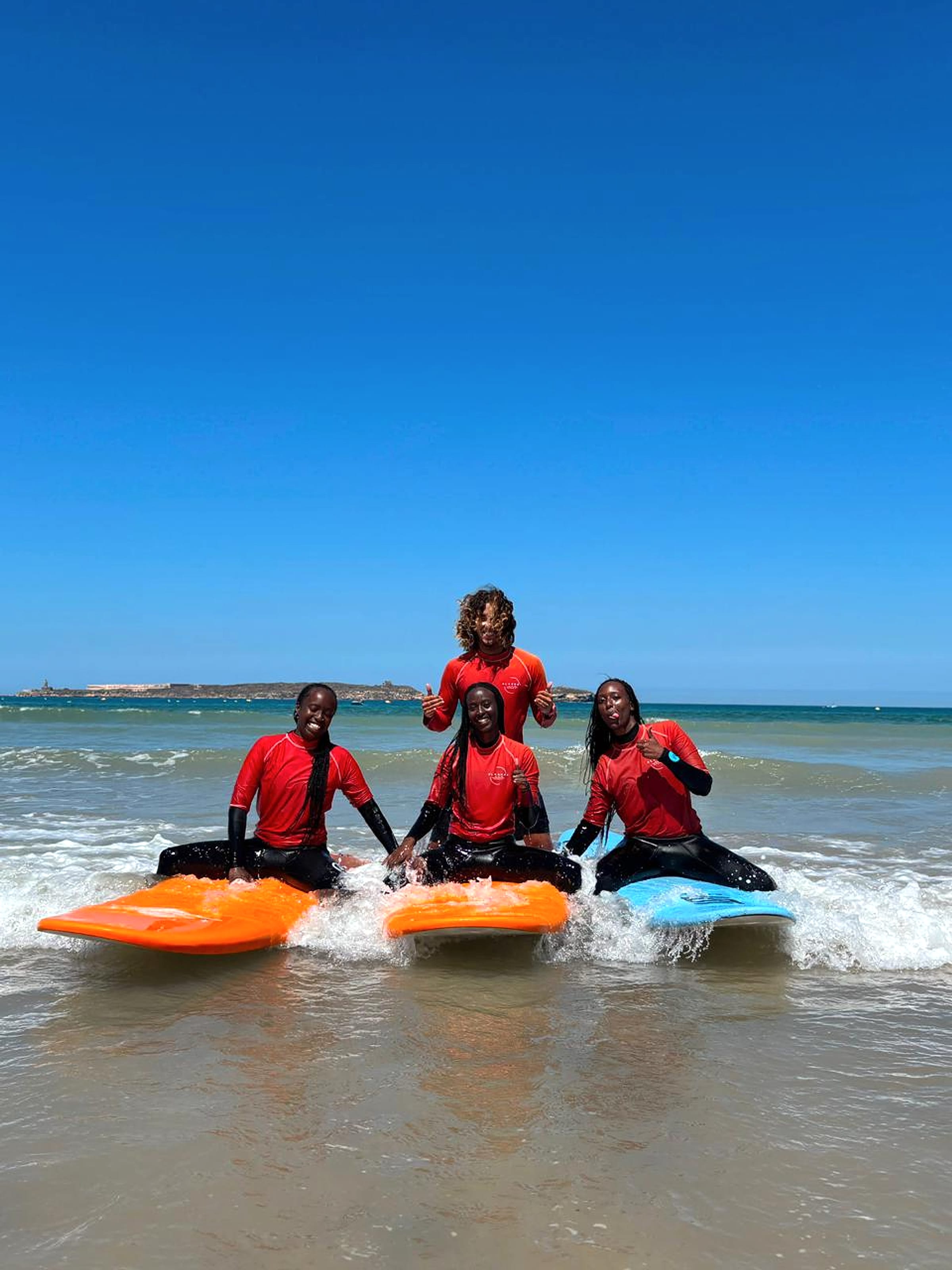 A group surf lesson takes place beside the Atlantic in Essaouira.