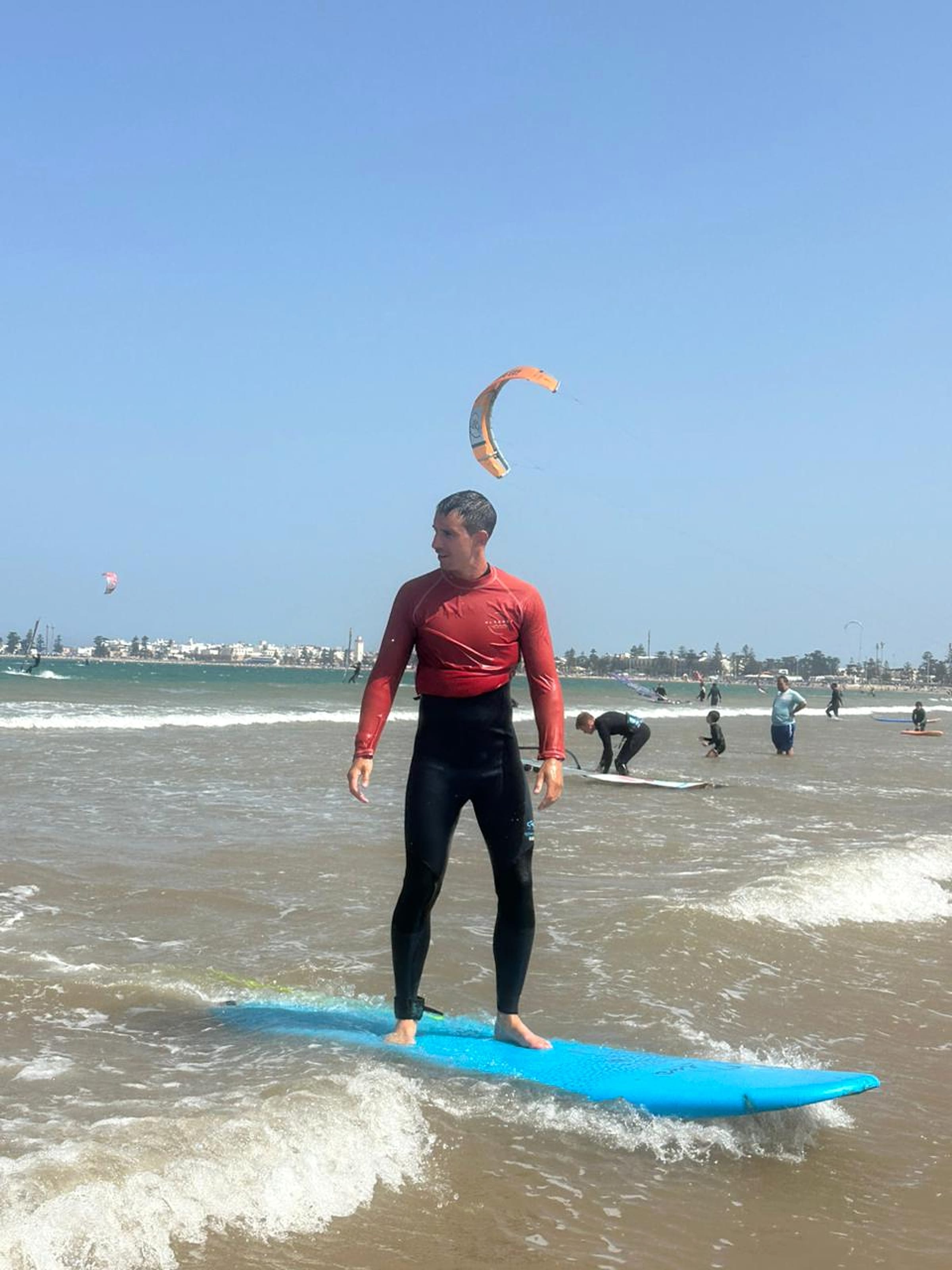 A surfer rides a small wave during a lesson in Essaouira.