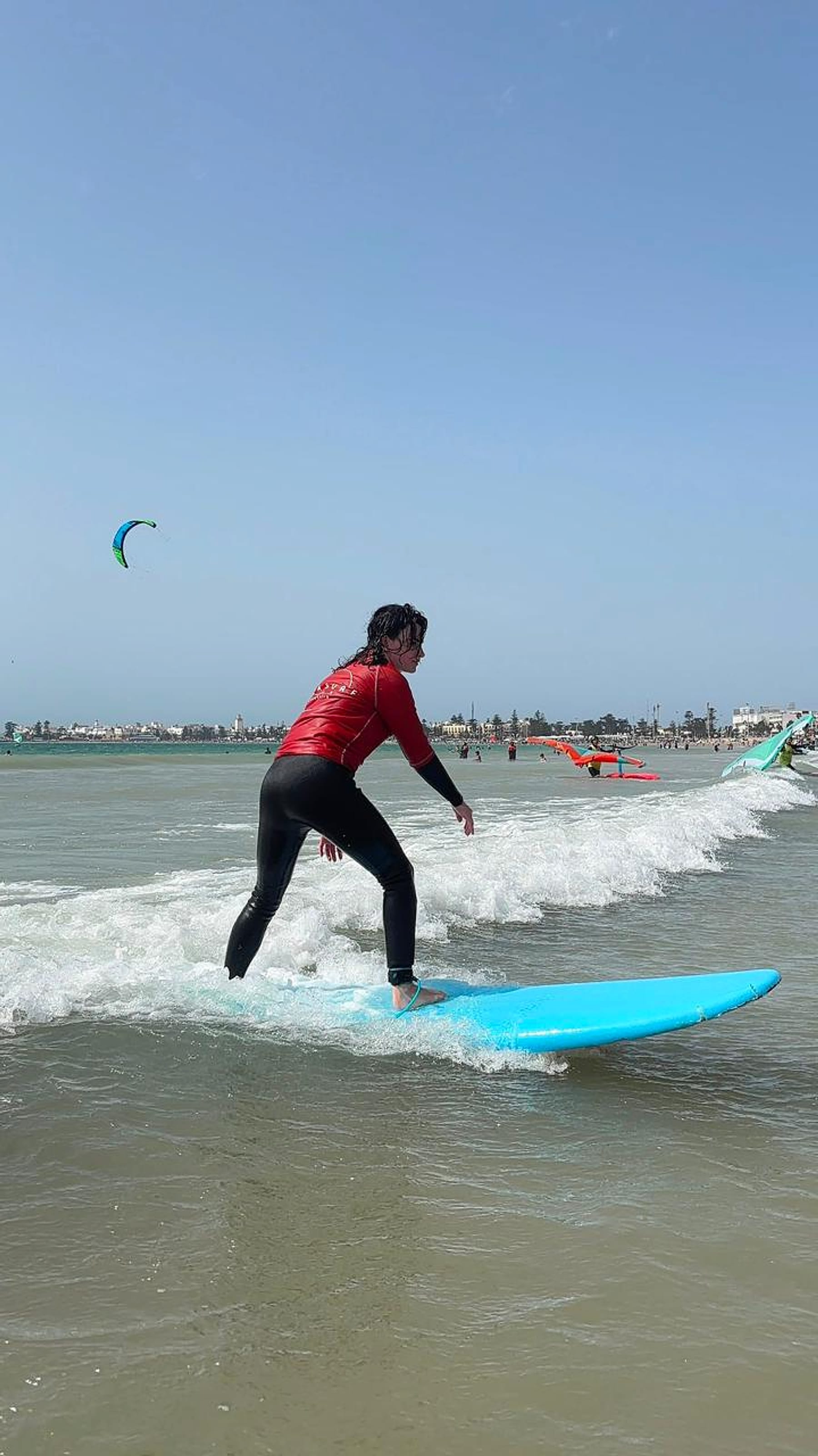 A surfer practises riding a wave during a session in Essaouira.