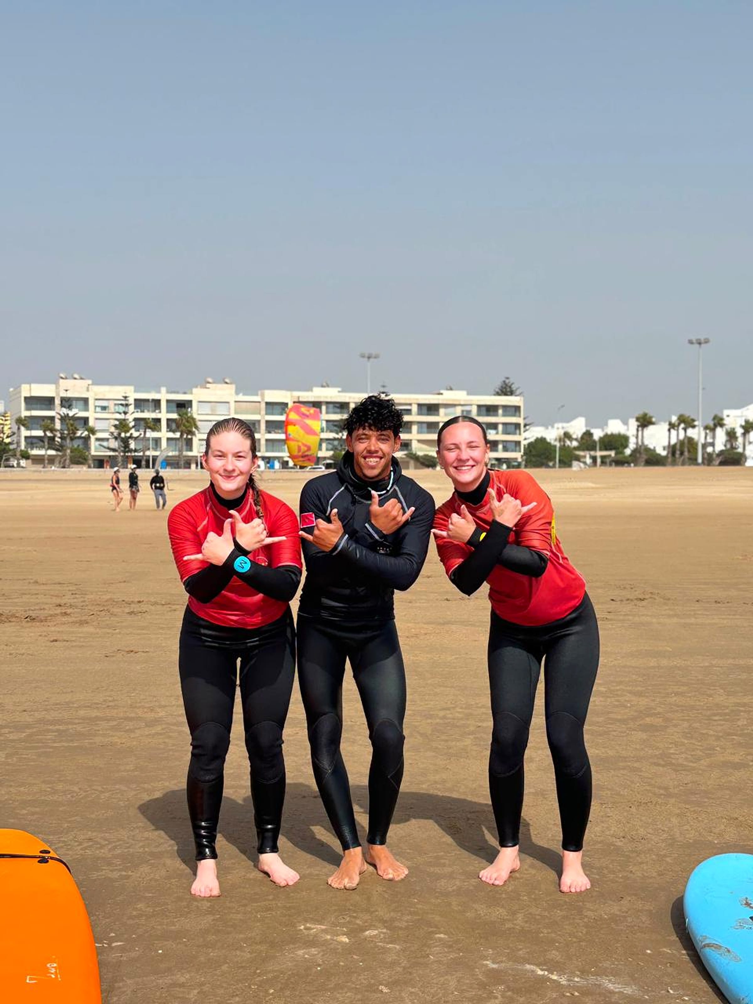 Three surfers take part in a session in the water at Essaouira.